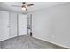 Bedroom featuring a ceiling fan, carpeted floor, and 2 doors at 2084 Bethel Nw Dr, Atlanta, GA 30314
