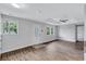Bright living room showcasing new flooring, fresh paint, and a modern ceiling fan at 2084 Bethel Nw Dr, Atlanta, GA 30314