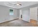 Spacious main bedroom with a ceiling fan, carpeted floors, and walk-in closet at 2084 Bethel Nw Dr, Atlanta, GA 30314