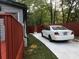 Exterior backyard view, with a car parked in the driveway at 3479 Thompson Nw Dr, Atlanta, GA 30331