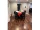 Dining room with wood floors, table with seating, and a view of the living area at 3479 Thompson Nw Dr, Atlanta, GA 30331
