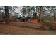 Charming single-story home with gray siding, an orange fence, and a well-maintained lawn at 3479 Thompson Nw Dr, Atlanta, GA 30331