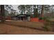Charming single-story home with gray siding, an orange fence, and a well-maintained lawn at 3479 Thompson Nw Dr, Atlanta, GA 30331