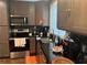The kitchen has stainless steel appliances, granite countertops, and gray cabinets at 3479 Thompson Nw Dr, Atlanta, GA 30331