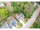 Aerial view of the home featuring a spacious backyard, fire pit, and lush landscaping at 533 Beecham Dr, Smyrna, GA 30082