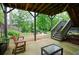 Patio leading to an outdoor fire pit surrounded by mature trees and landscaped garden beds at 533 Beecham Dr, Smyrna, GA 30082