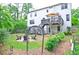 Expansive fenced backyard with a fire pit, a vegetable garden, and a deck great for entertaining at 533 Beecham Dr, Smyrna, GA 30082