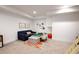 Finished basement features a neutral decor with a plush seating area and play space at 533 Beecham Dr, Smyrna, GA 30082