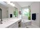 This bathroom offers marble floors, corner tub, vanity area with mirrors, and greenery at 533 Beecham Dr, Smyrna, GA 30082
