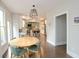 Bright dining area featuring modern lighting and an open floor plan leading to the kitchen and living spaces at 533 Beecham Dr, Smyrna, GA 30082