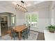 Bright dining room with white wainscoting, a natural wood table, and natural light at 533 Beecham Dr, Smyrna, GA 30082