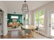Bright dining area with a stylish table set, large windows offering views, and an open layout to the cozy living room at 533 Beecham Dr, Smyrna, GA 30082