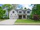 Beautiful two-story home featuring a well-maintained lawn and a two car garage at 533 Beecham Dr, Smyrna, GA 30082