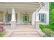 Charming front porch featuring brick accents, and a welcoming entryway at 533 Beecham Dr, Smyrna, GA 30082
