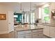 Bright, modern kitchen with granite countertops, stainless steel appliances, and a view to the breakfast area at 533 Beecham Dr, Smyrna, GA 30082