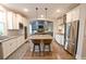 Well-appointed kitchen with stainless appliances, granite counters, an island with seating, and an open design to living spaces at 533 Beecham Dr, Smyrna, GA 30082