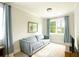 View of the living room with a gray couch, large window, and plush rug at 533 Beecham Dr, Smyrna, GA 30082