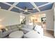 Spacious living room features a gray sectional, stylish ceiling design, and seamless flow to other living areas at 533 Beecham Dr, Smyrna, GA 30082