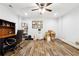 Basement office featuring an executive chair, a dark wood desk, and wood-look floors at 825 Kennedy Ct, Loganville, GA 30052