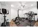Well-equipped basement gym with an exercise bike, treadmill, and weight training equipment at 825 Kennedy Ct, Loganville, GA 30052