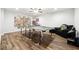 Spacious finished basement with a ping pong table and a dark accent chair at 825 Kennedy Ct, Loganville, GA 30052
