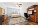 Bedroom with natural lighting, a ceiling fan and a study area at 825 Kennedy Ct, Loganville, GA 30052