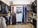 Walk-in closet with shelves and racks for clothing storage at 825 Kennedy Ct, Loganville, GA 30052
