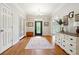 Bright entryway with hardwood floors, stylish decor, and a glass-paneled front door with sidelights at 825 Kennedy Ct, Loganville, GA 30052