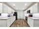 Modern kitchen with granite countertops, stainless steel appliances, and ample cabinet space at 825 Kennedy Ct, Loganville, GA 30052