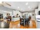 Spacious kitchen with white cabinets, stainless steel appliances, and a kitchen island with bar stool seating at 825 Kennedy Ct, Loganville, GA 30052