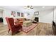 Cozy living room featuring natural lighting and fireplace at 825 Kennedy Ct, Loganville, GA 30052