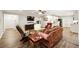 Open concept living area featuring hardwood floors, and access to the kitchen area at 825 Kennedy Ct, Loganville, GA 30052