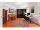 Dedicated home office featuring a piano, built-in bookcase, desk, and large windows for natural light at 825 Kennedy Ct, Loganville, GA 30052