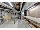 Unfinished basement with exposed ductwork and concrete floors at 1450 Holly Bank Cir, Atlanta, GA 30338