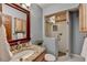 Bathroom with granite countertops, custom mirror, wood cabinetry and glass enclosed shower at 1450 Holly Bank Cir, Atlanta, GA 30338