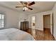 Bedroom with hardwood floors, ceiling fan, and access to the bathroom at 1450 Holly Bank Cir, Atlanta, GA 30338