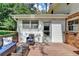 Deck with outdoor seating and a view of the backyard at 1450 Holly Bank Cir, Atlanta, GA 30338
