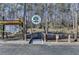Inviting entrance to Dunwoody Nature Center with welcome sign and accessible ramp at 1450 Holly Bank Cir, Atlanta, GA 30338