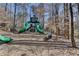 Community playground in natural setting with slides, climbing structures, and room to play at 1450 Holly Bank Cir, Atlanta, GA 30338