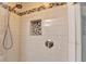 Modern shower featuring subway tile, mosaic accents, shower niche, and a bronze shower head fixture at 1450 Holly Bank Cir, Atlanta, GA 30338