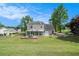 Expansive backyard featuring a patio, shed, and green lawn, perfect for outdoor enjoyment at 1625 Summit View Way, Snellville, GA 30078