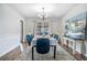 Dining room with neutral colors, hardwood floors, stylish chandelier, and a large window for natural light at 1625 Summit View Way, Snellville, GA 30078