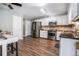 Bright, updated kitchen with stainless steel appliances, granite countertops, and hardwood floors with plenty of space at 1625 Summit View Way, Snellville, GA 30078