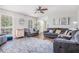 Cozy living room with hardwood floors, a comfortable sectional, and large windows, perfect for Gathering gatherings at 1625 Summit View Way, Snellville, GA 30078