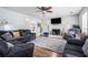 Spacious living room with a fireplace, TV, and comfortable seating, ideal for relaxation and entertainment at 1625 Summit View Way, Snellville, GA 30078