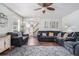 Inviting living room with comfortable seating, hardwood floors, and lots of natural light from the large windows at 1625 Summit View Way, Snellville, GA 30078