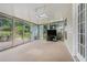 Bright sunroom with sliding glass doors, a skylight, and views of the backyard at 1625 Summit View Way, Snellville, GA 30078
