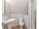 Bathroom featuring a pedestal sink, toilet, and a shower at 1981 Luke Edwards Rd, Dacula, GA 30019
