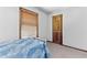 Bedroom features one twin bed, neutral carpet, and a window with wood trim at 1981 Luke Edwards Rd, Dacula, GA 30019