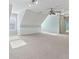 Bright bonus room featuring a ceiling fan and storage shelves at 1981 Luke Edwards Rd, Dacula, GA 30019
